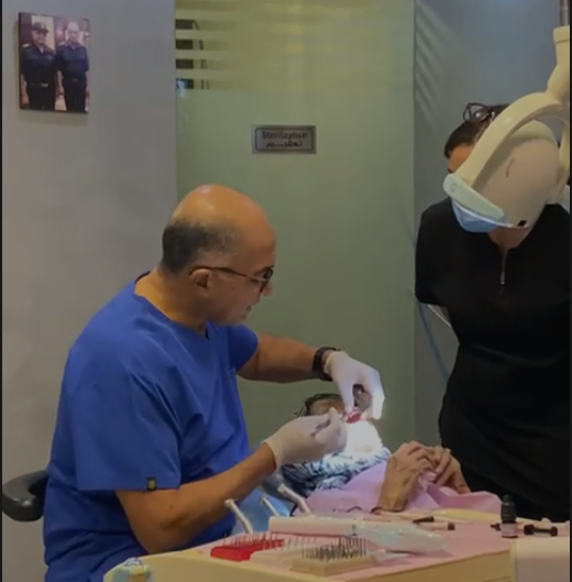 Dr Raafat performing treatment